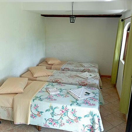 Pousada Nossa Senhora Penedo Kültér fotó A bedroom in a hostel