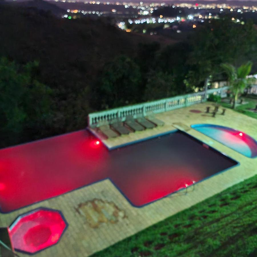 Pousada Nossa Senhora Penedo Kültér fotó The swimming pool at the resort