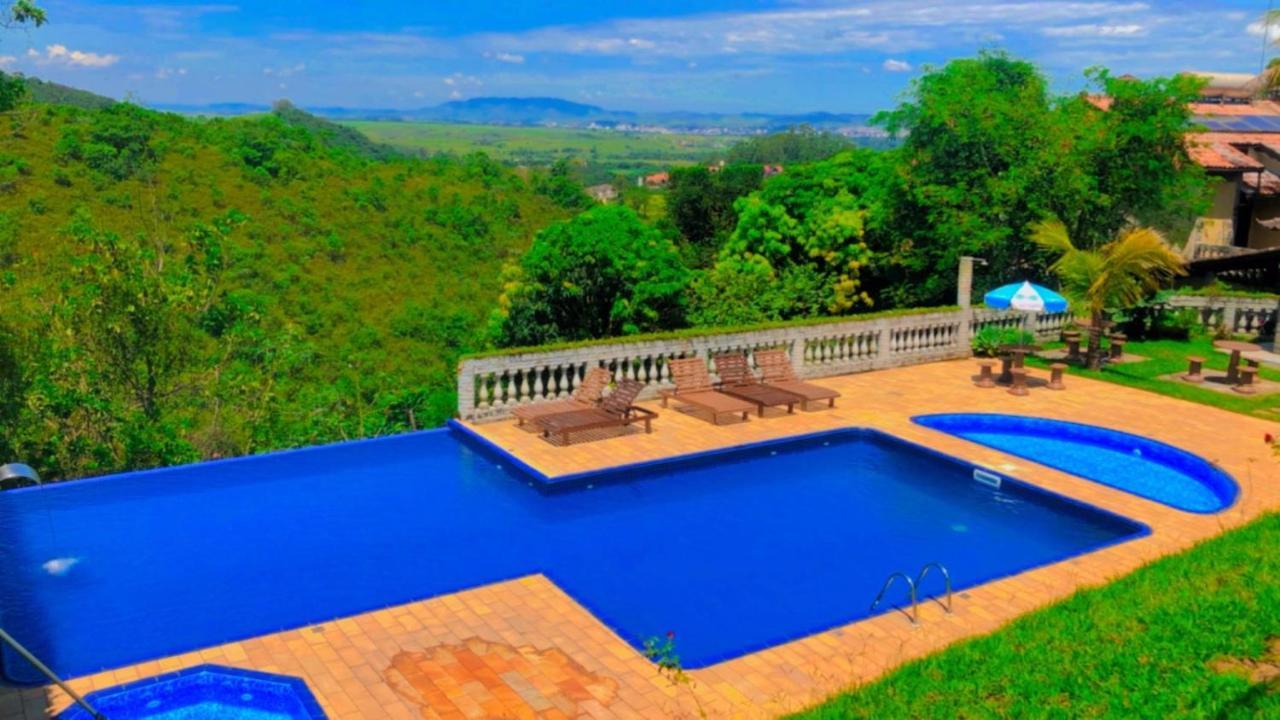 Pousada Nossa Senhora Penedo Kültér fotó View of the swimming pool at the hotel