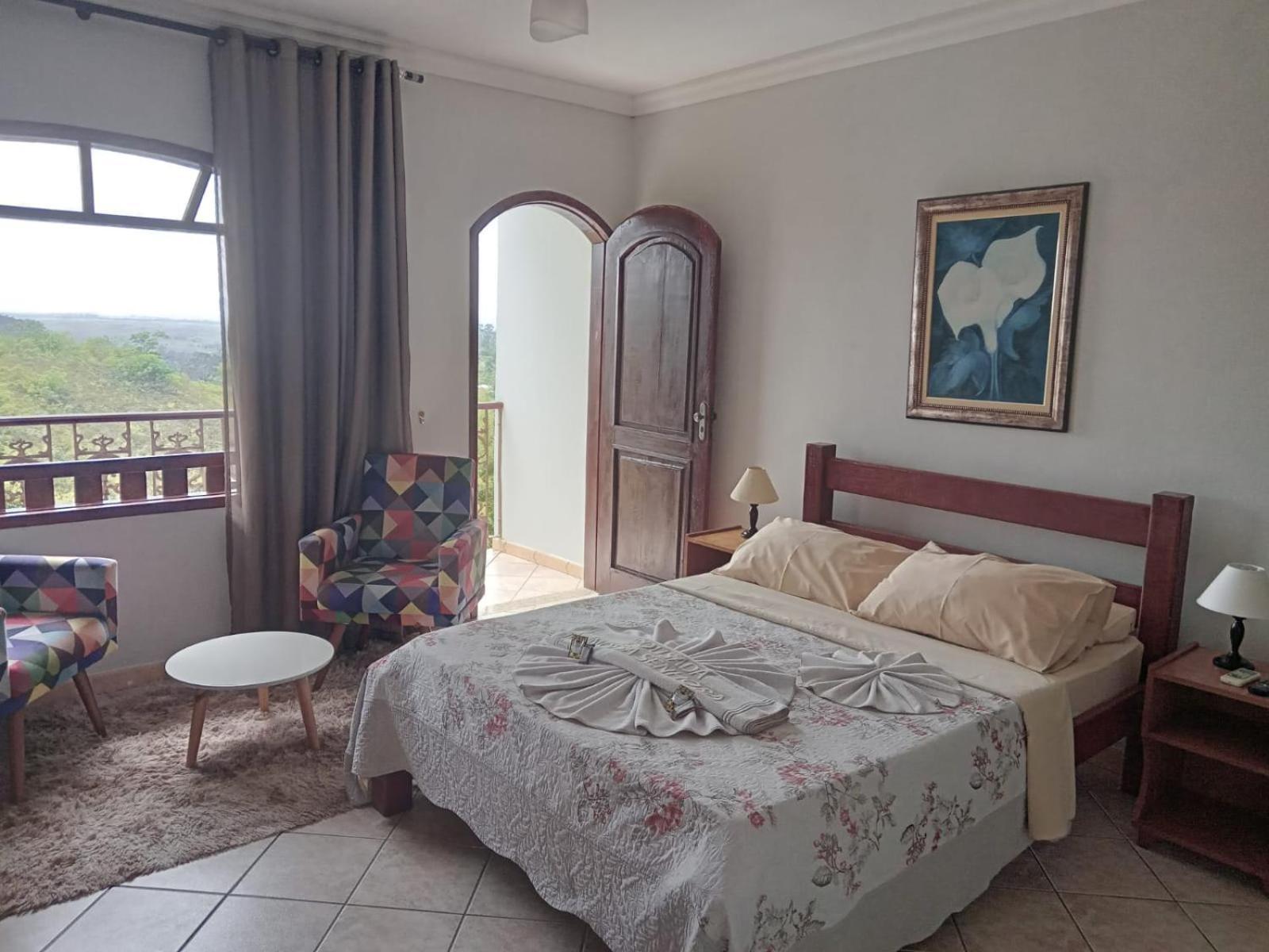 Pousada Nossa Senhora Penedo Szoba fotó A bedroom in a hotel