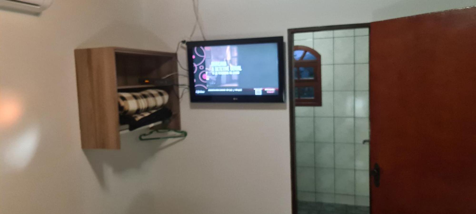 Pousada Nossa Senhora Penedo Szoba fotó A television set in a hotel room