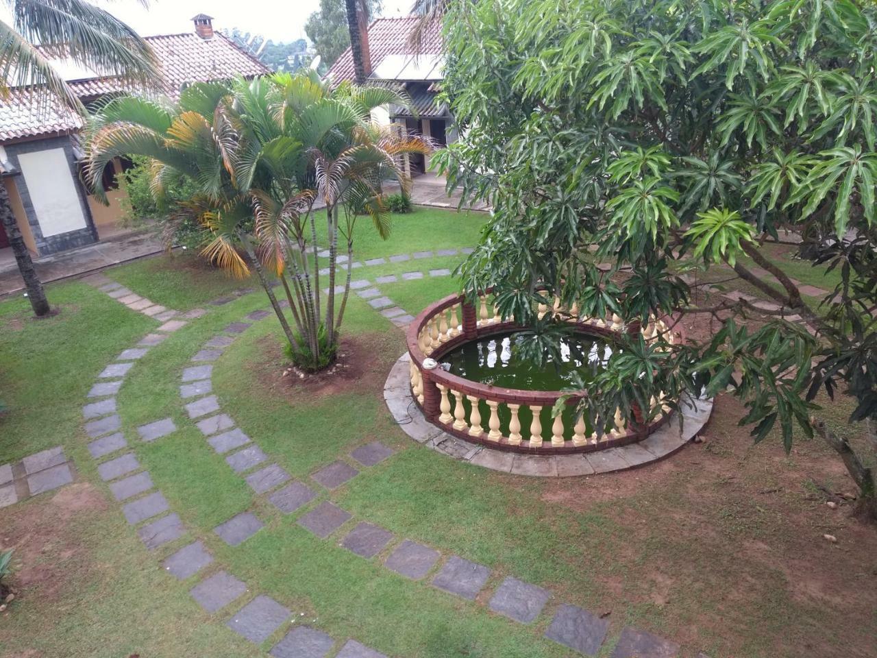 Pousada Nossa Senhora Penedo Kültér fotó The garden of the house